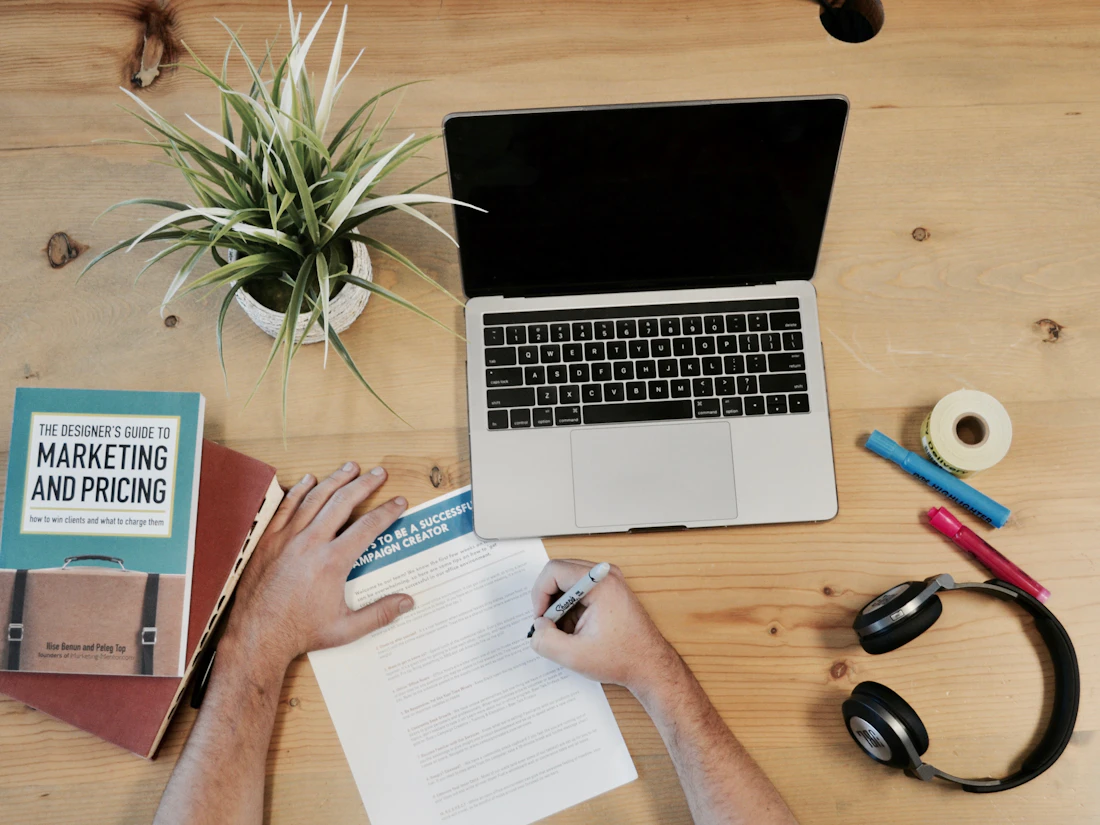 Conversion-focused landing page being designed on a laptop at a workspace