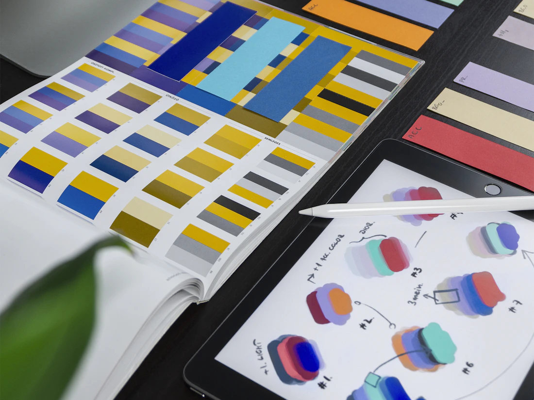 Interface design system with components colours and typography shown on screen