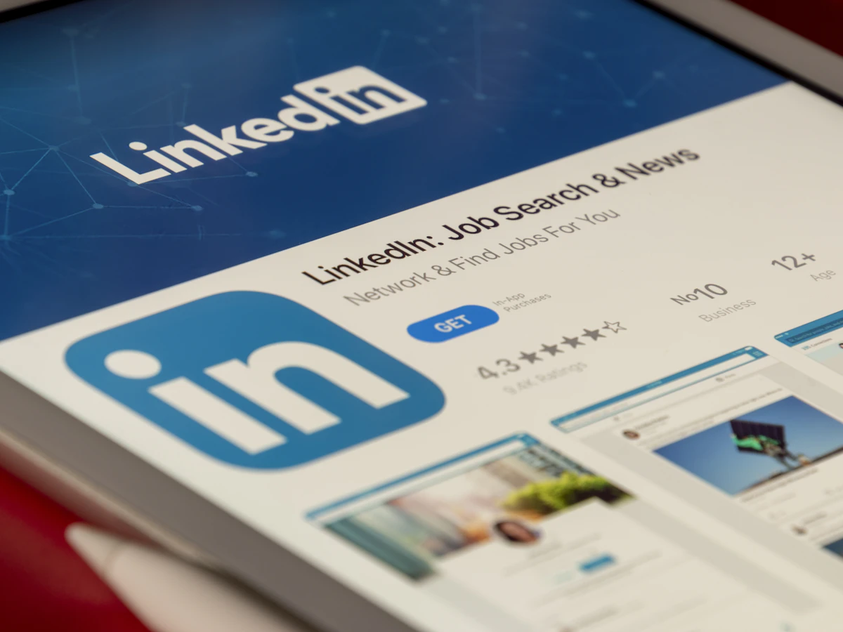 LinkedIn profile and company page open on a laptop screen for B2B marketing